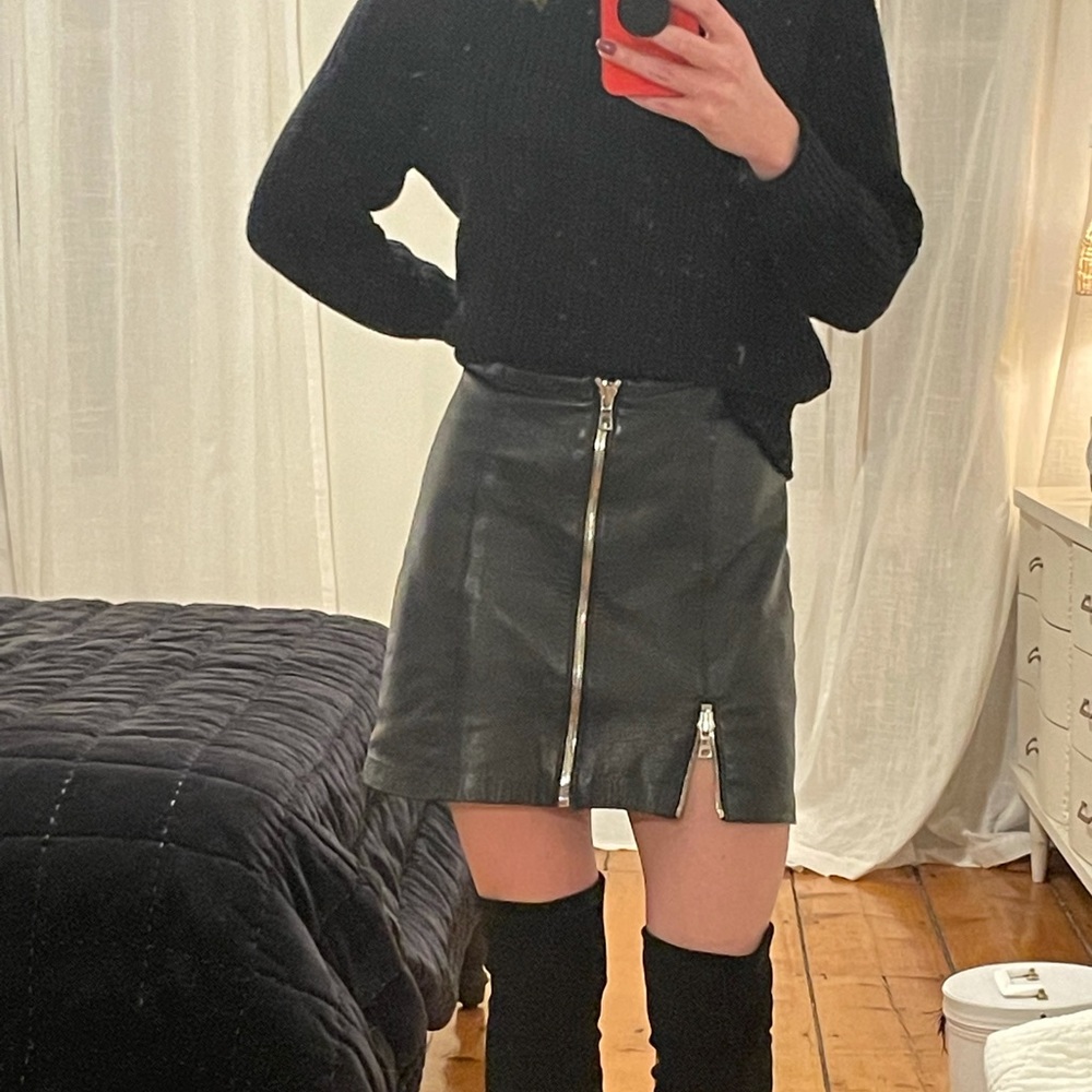 Reformation black zip up vegan leather mini skirt. Waist measurement 28 inches.